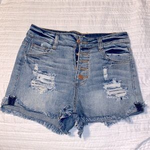 Refuge high waisted jean shorts. Size 4 holes on front pockets.